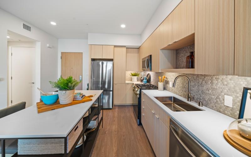 a kitchen with wooden cabinets