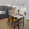 a kitchen with a table and chairs