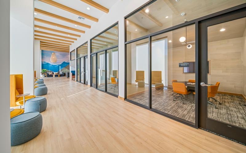 a room with a glass wall and a large glass door
