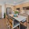 a kitchen with a table and chairs