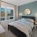 a bedroom with a large window
