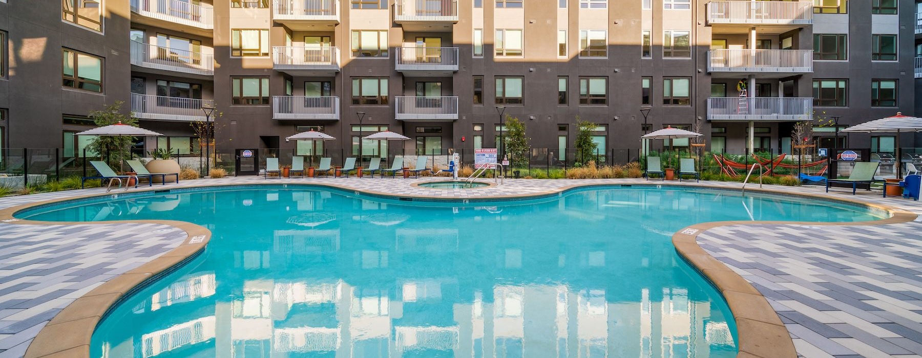 a pool in front of a building