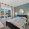 a bedroom with a bed and two nightstands