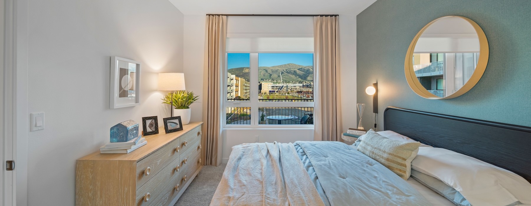a bedroom with a large mirror