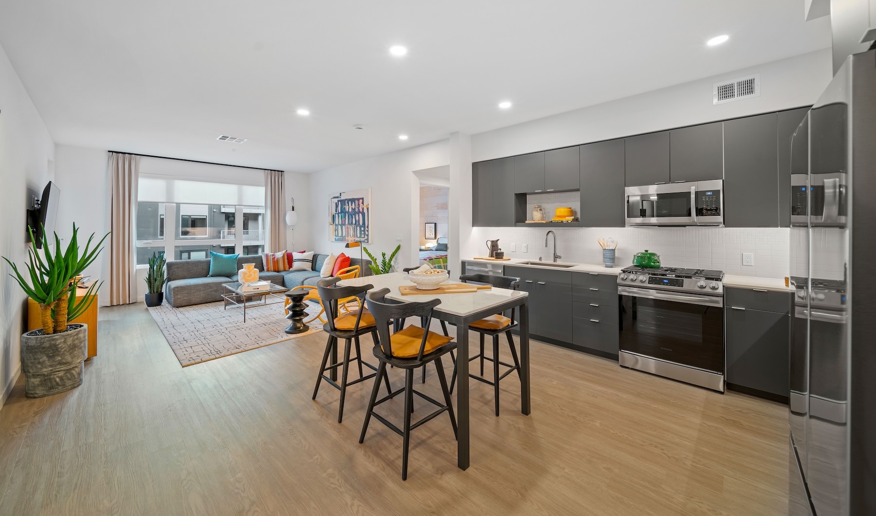 a kitchen with a dining table and chairs