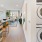 a kitchen with a washing machine and a table