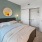 a bedroom with a mirror and a bed