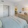 a bedroom with a bed and dresser