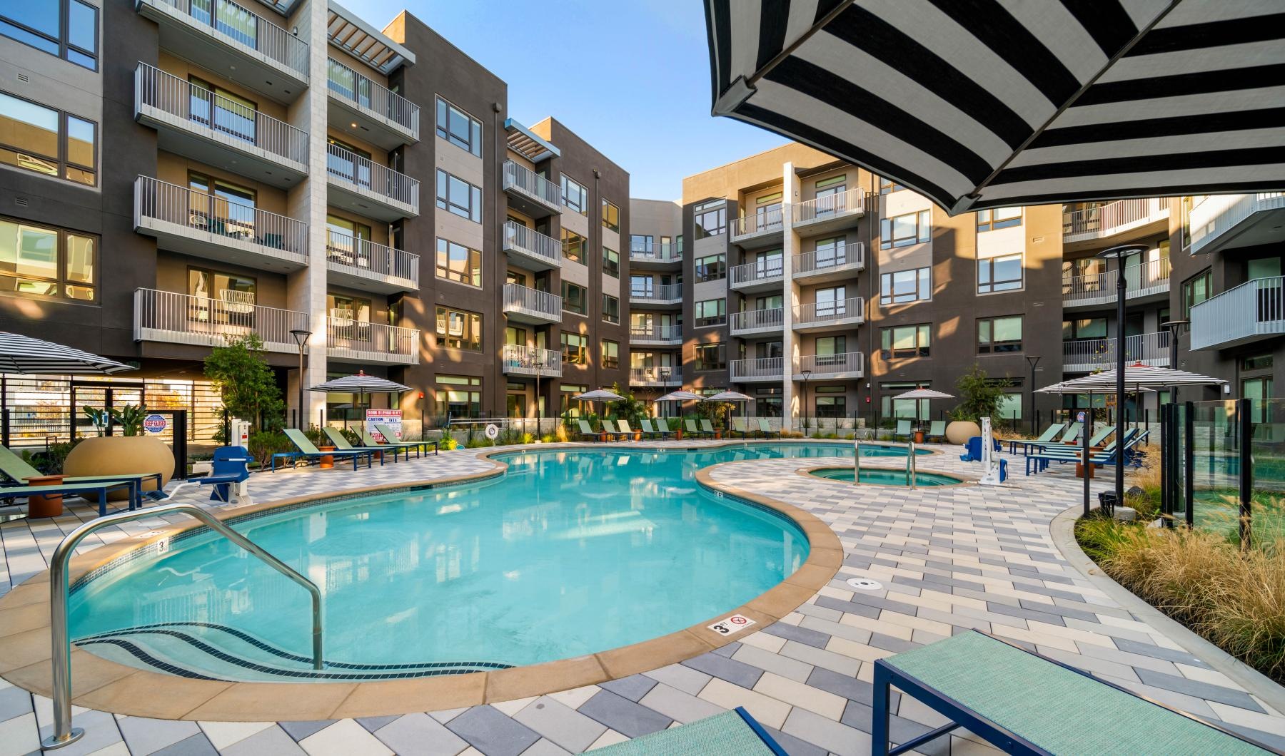 Relax and unwind poolside a pool in a resort