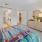 a bedroom with a bed and a mirror