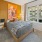 a bedroom with a large window