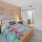 a bedroom with a bed and a tv